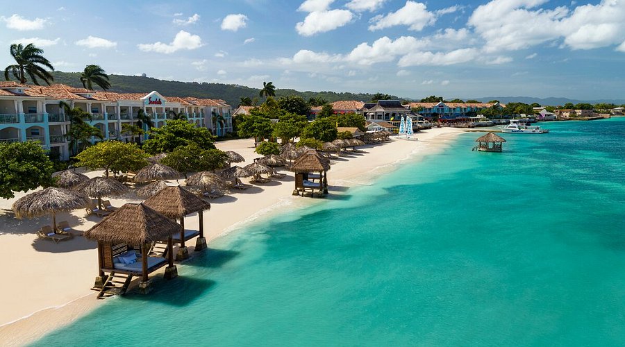 Beachfront resort setting at Sandals Montego Bay with turquoise Caribbean water