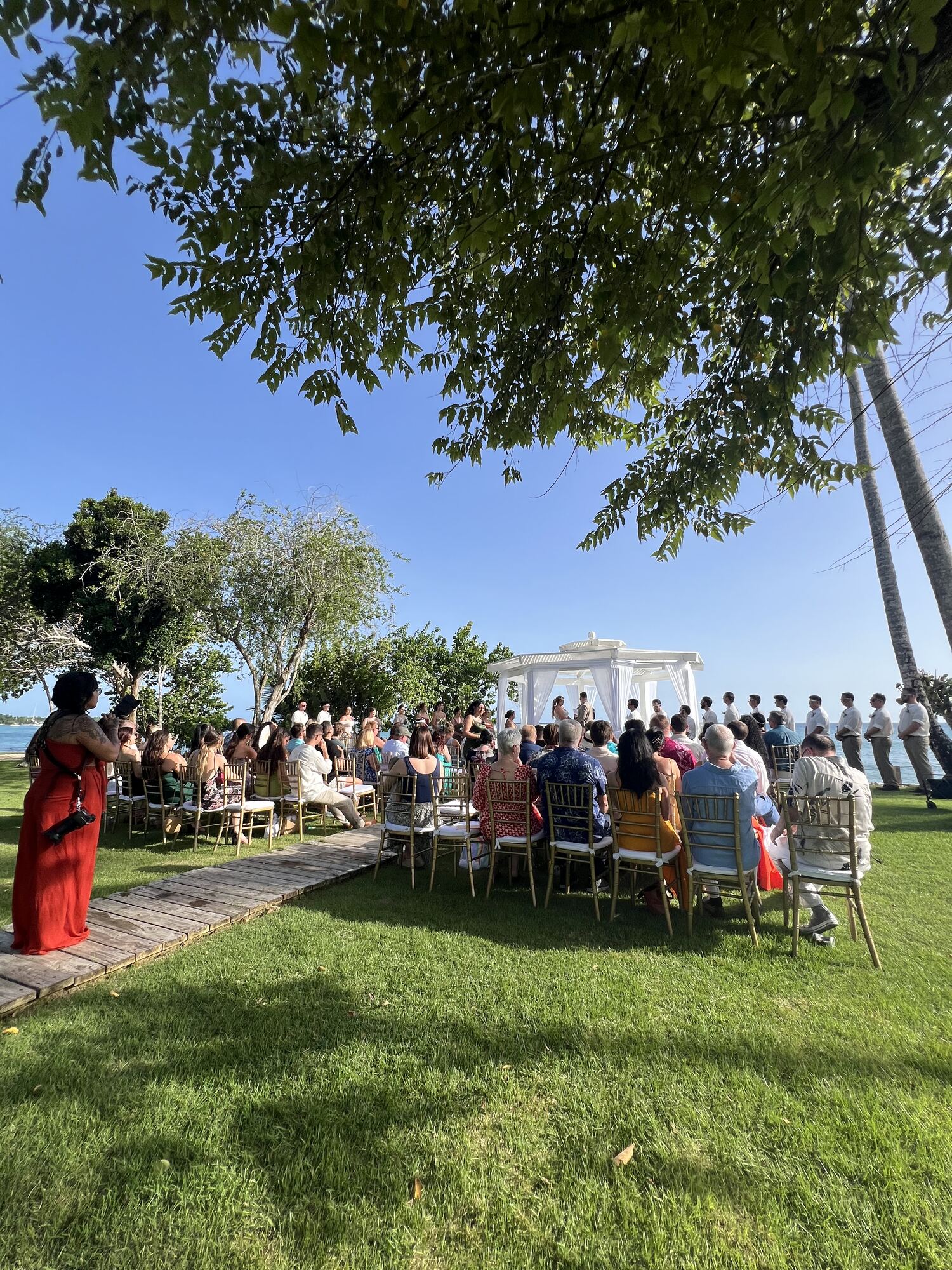 Wedding guests arriving together by resort shuttle with luggage