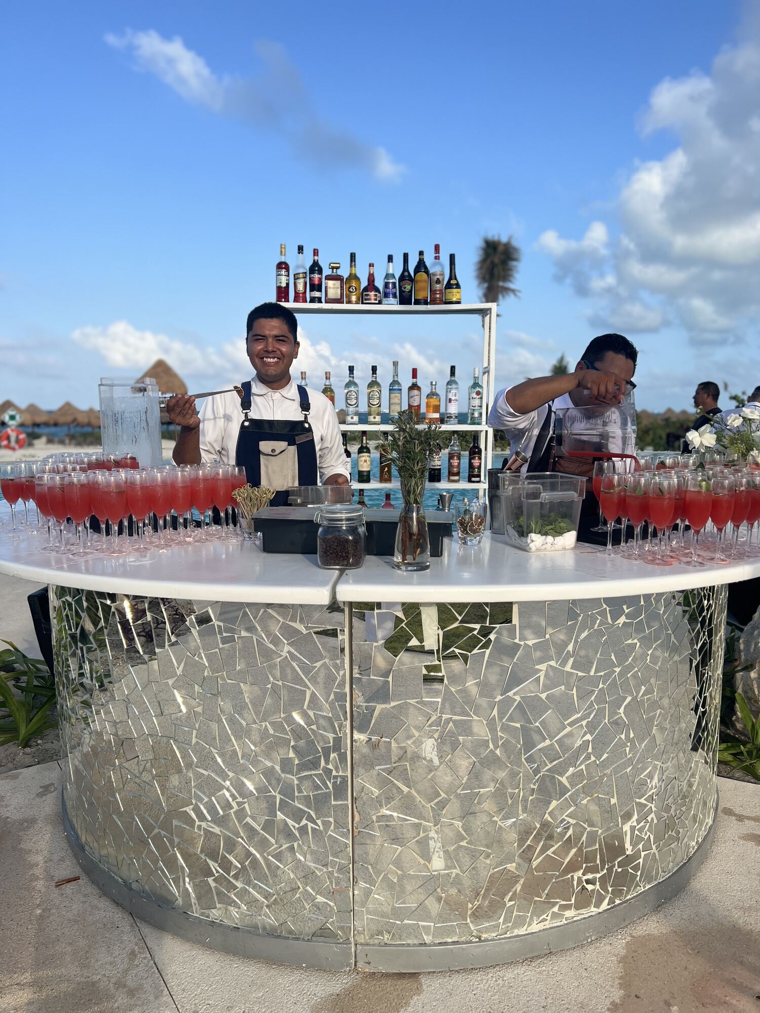Oceanfront wedding gazebo at an all-inclusive Caribbean resort — the kind of Mexico, Dominican Republic, or Jamaica setting that keeps per-guest costs manageable