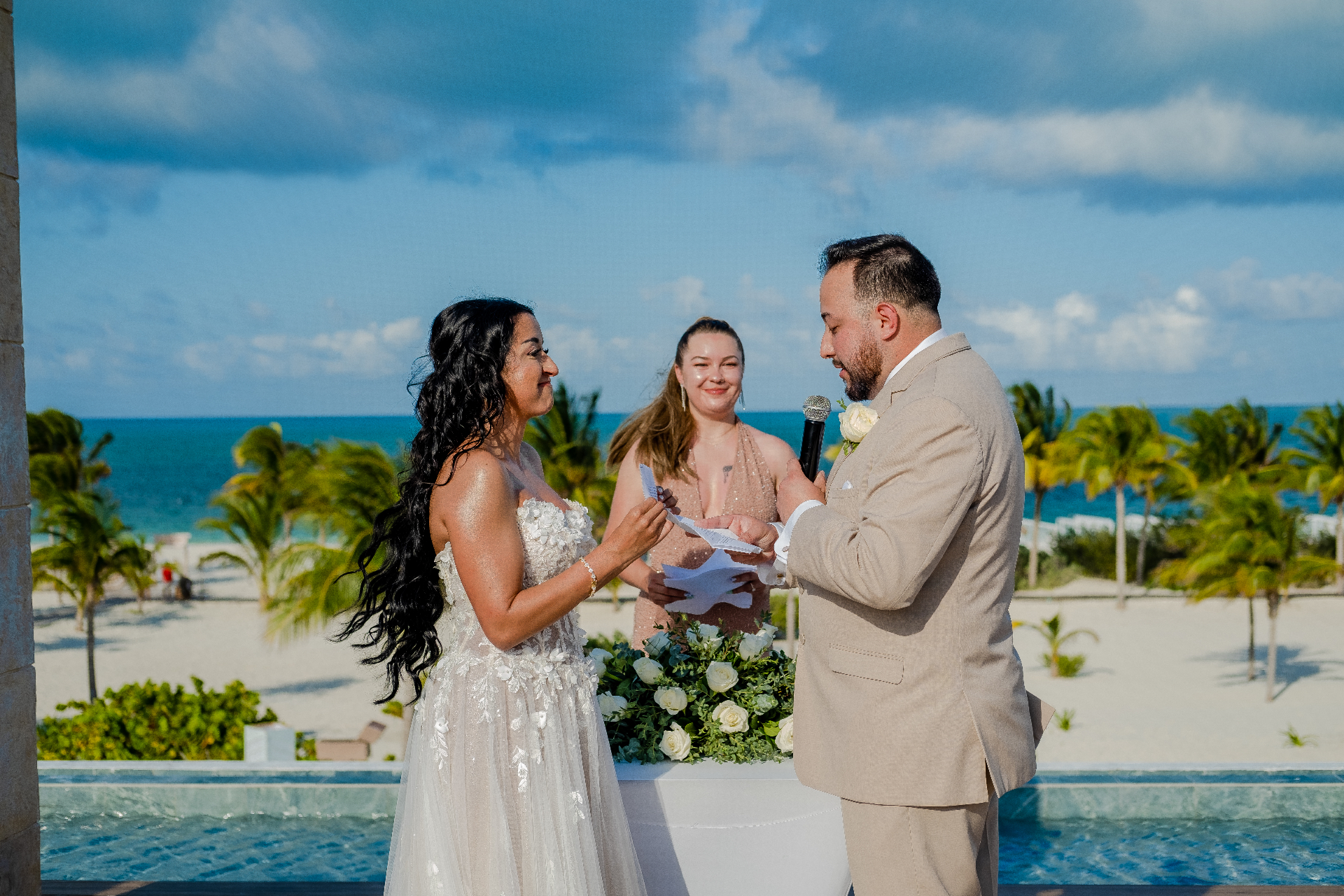 Officiant leading vows during a destination wedding ceremony