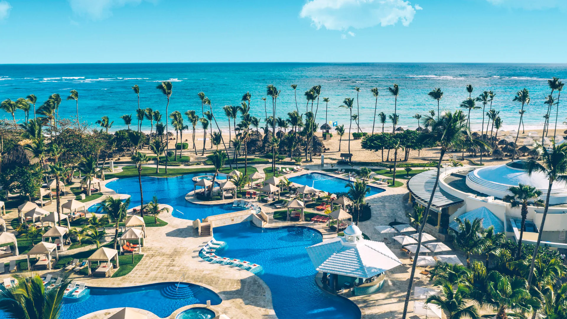 Beachfront resort setting along Bávaro Beach in Punta Cana with palms and turquoise Caribbean water