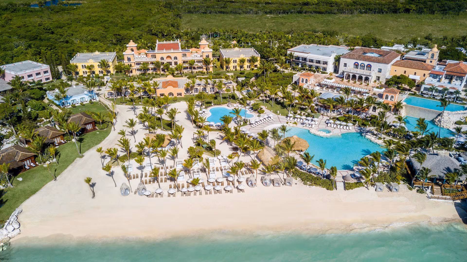 Mediterranean-inspired architecture and private cove beach at a Cap Cana luxury resort in the Dominican Republic