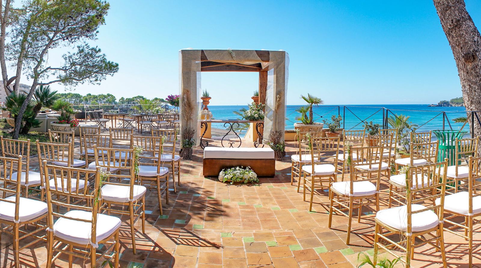 Garden reception setup with string lights and tropical landscaping at an all-inclusive resort