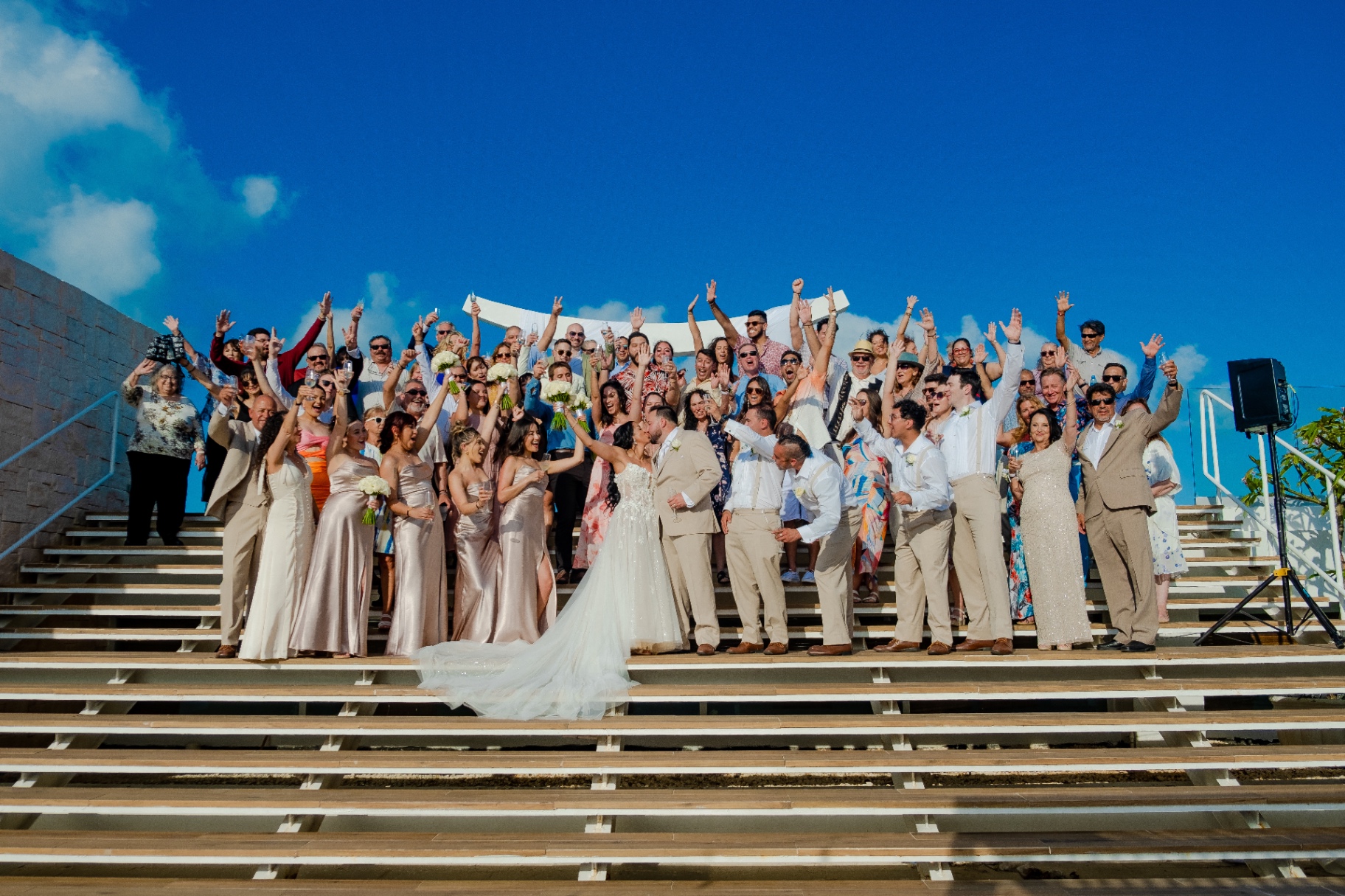 Wedding party and guests celebrating with a champagne toast