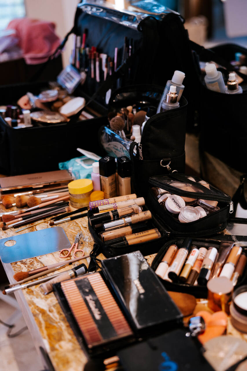 Professional hair and makeup artist's kit set up for destination wedding bridal party services