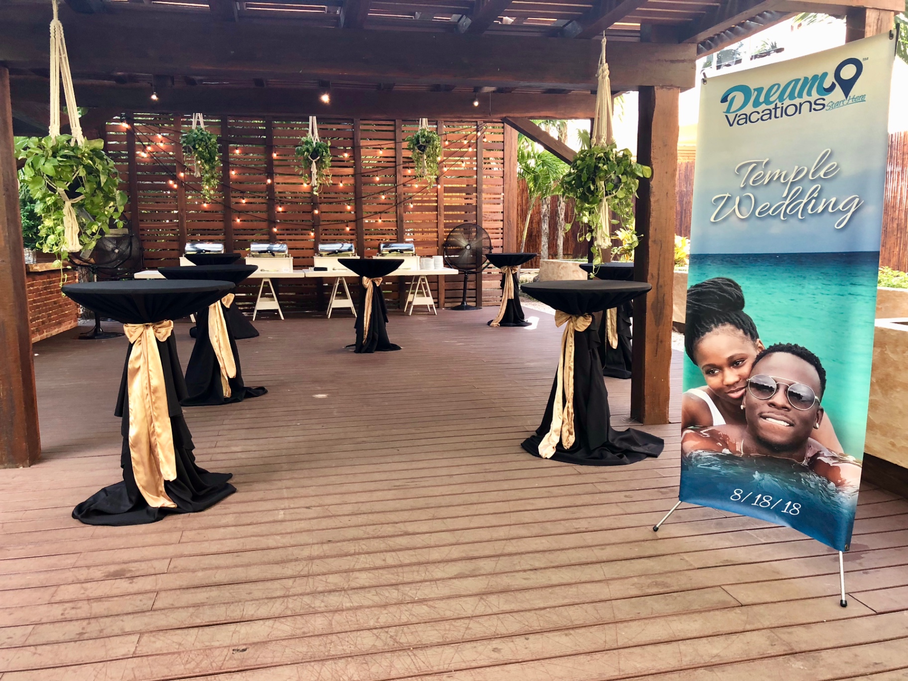 Intimate destination wedding cocktail hour setup at a resort, arranged for a small guest count — the kind of small-footprint celebration that unlocks the biggest cost savings