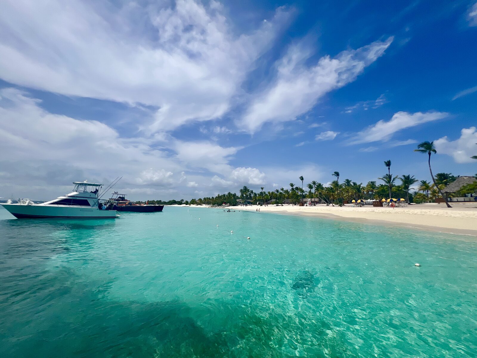 Clear turquoise Caribbean water and a small excursion boat off the Bayahibe coast in the eastern Dominican Republic